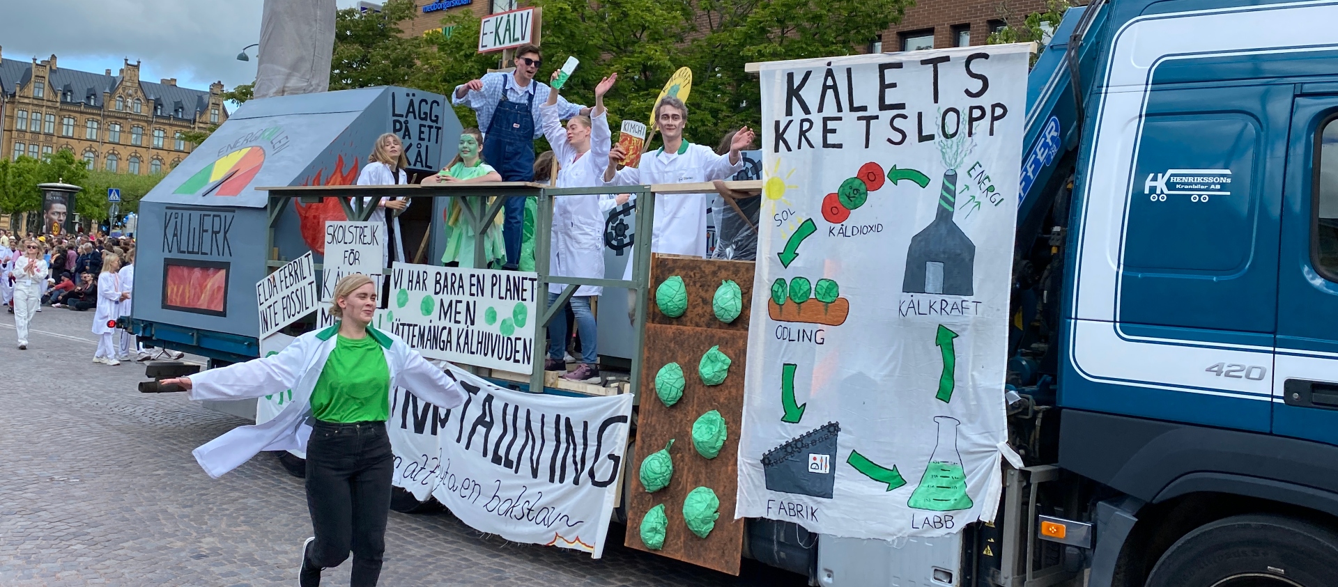 A truck with banners and people